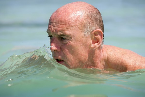 portrait of elderly man bathing in