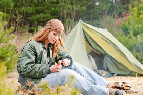 camping woman tent nature cut sausage