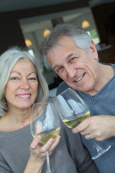 portrait of happy senior couple cheering