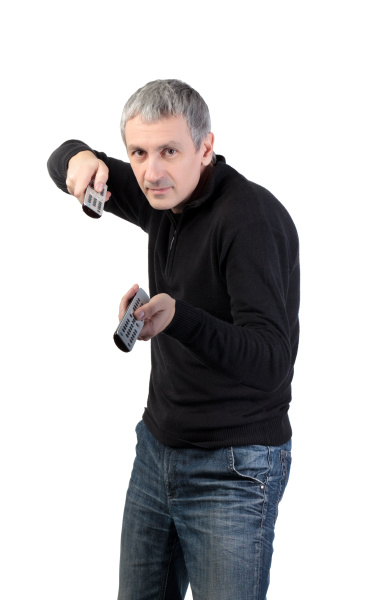 man changing channel with a remote