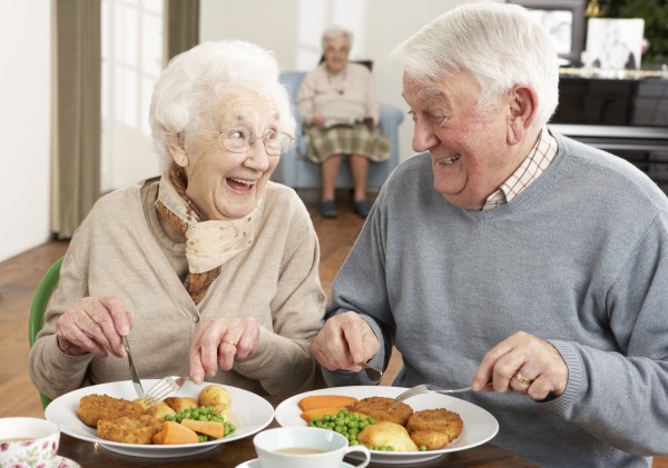 senior couple enjoying meal together