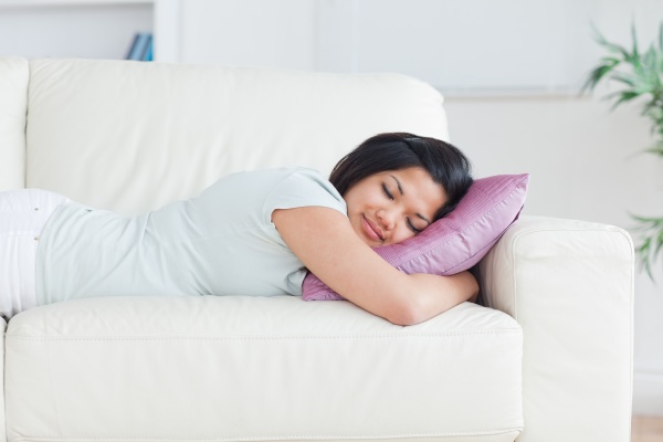woman sleeping on a couch with