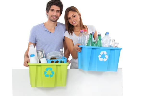couple recycling plastic bottles