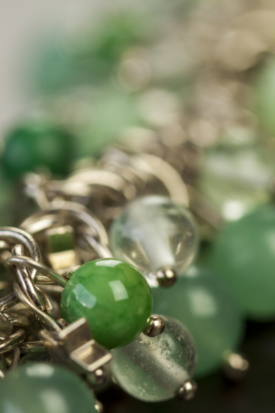 silver necklace bracelet with green gemstones