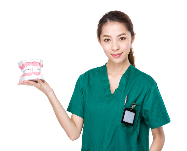 asian dentist with denture