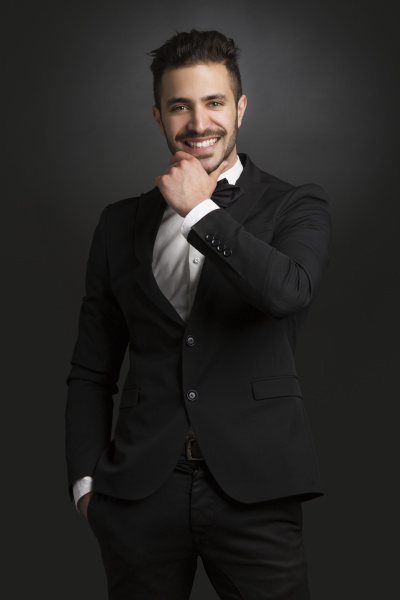 latin man wearing a tuxedo
