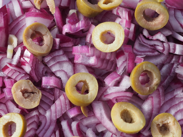 chopped red onions with olives