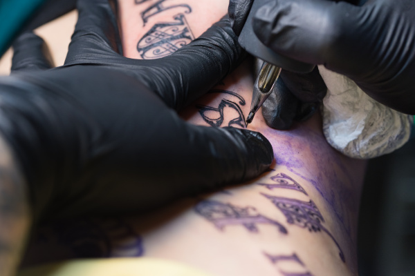 girl getting tattoo