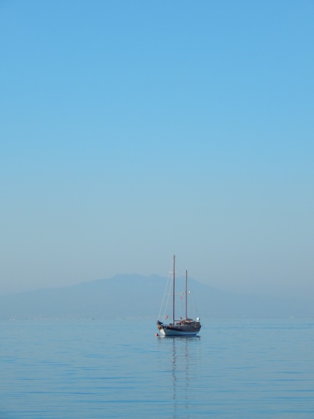 sailboat on calm waters against a