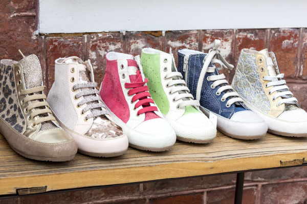 sporty dam shoes on wooden board