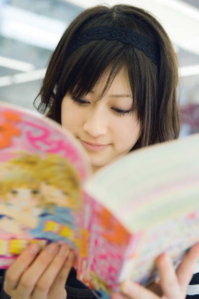 young japanese woman reading manga style