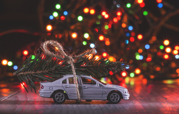 car toy with christmas tree on