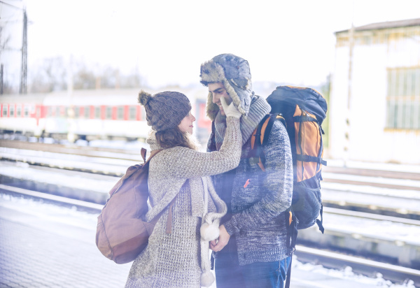 young couple on station platform