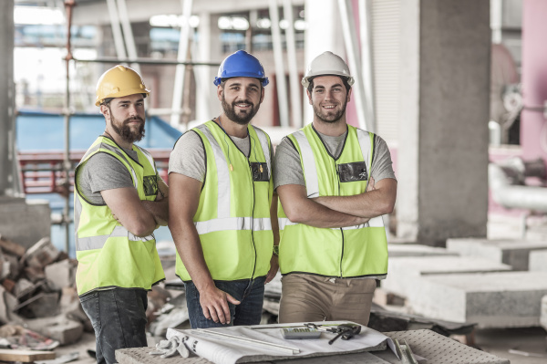 portrait of confident construction workers in