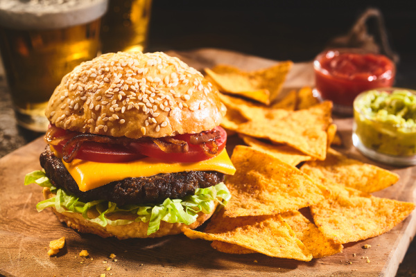 burger with beer and nachos appetizers