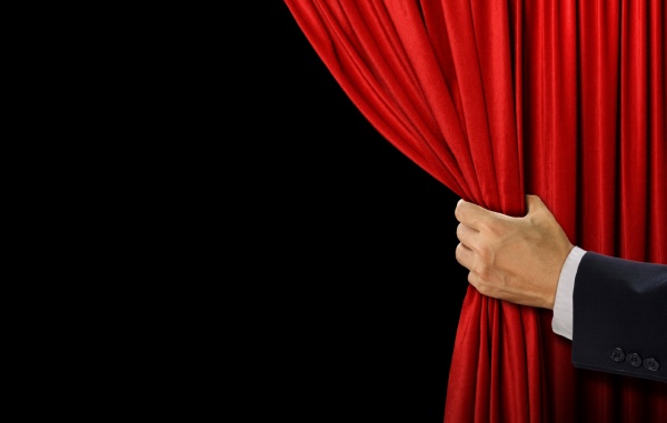 hand open stage red curtain on