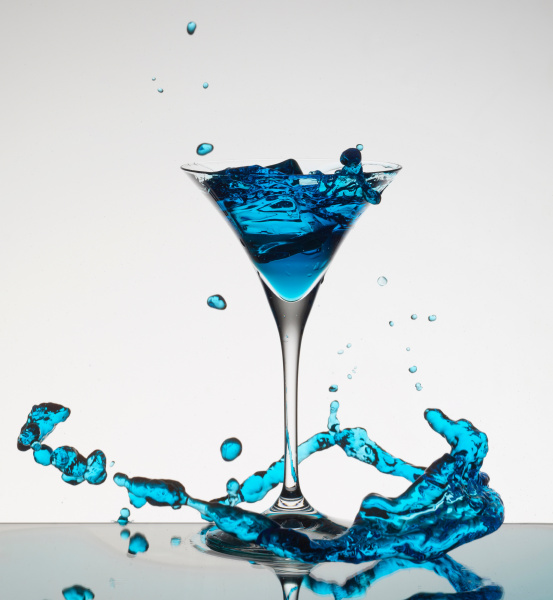 cocktail splashing around martini glass