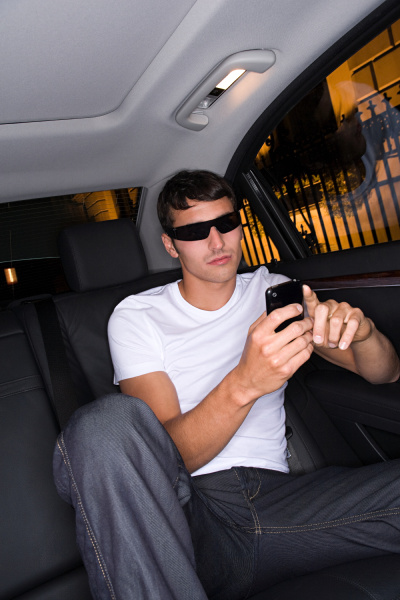 cool man text messaging in car