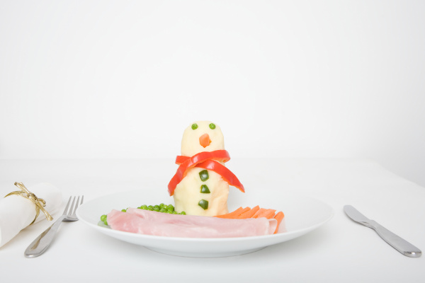 a food snowman on a plate