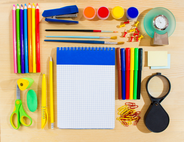 school items making frame on wooden
