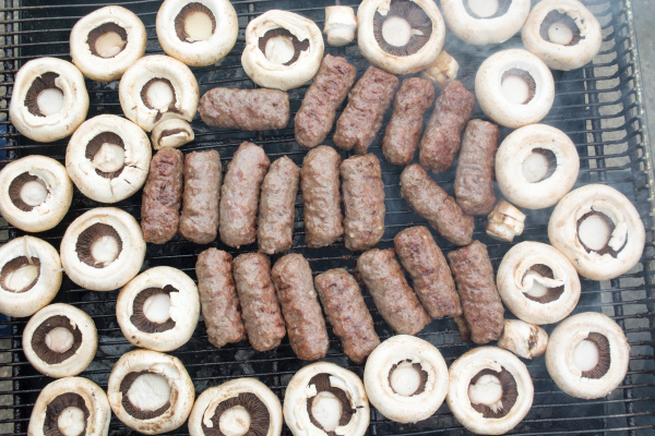 grilling meat with mushrooms