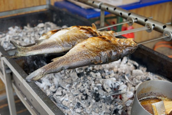 fish grilled over charcoal