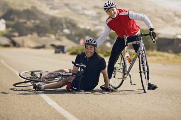 mature man falls down while cycling