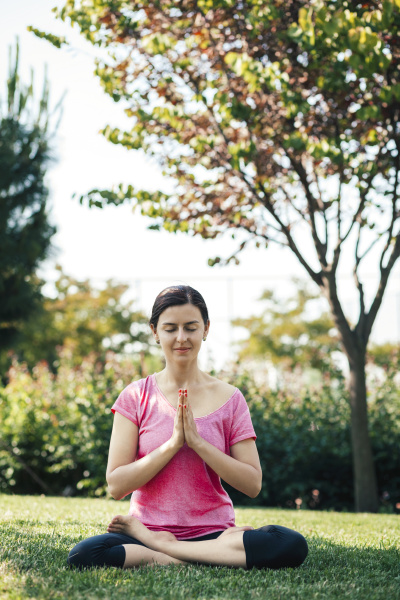 young woman doing yoga and meditation