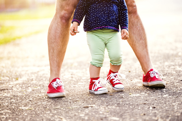 legs of little girl and her