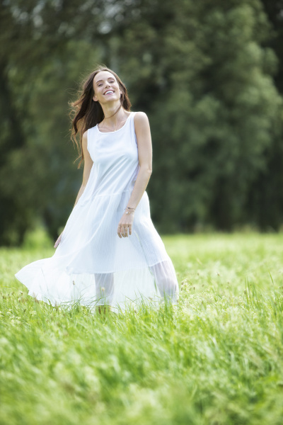 happy woman wearing white summer dress