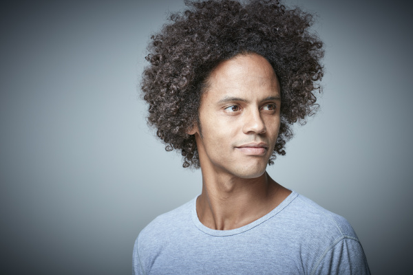 portrait of relaxed man with afro