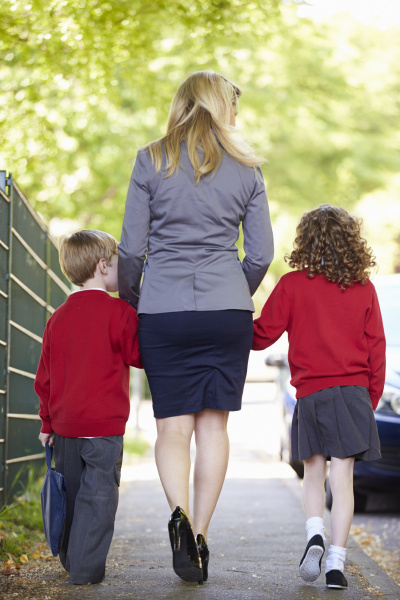 mother walking to school with children