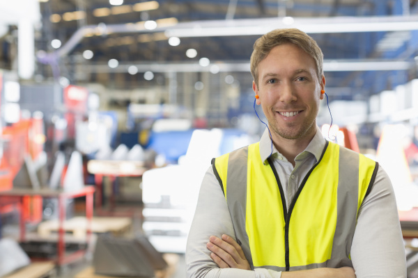 portrait smiling supervisor in steel factory