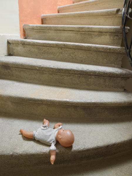 doll on the stairs