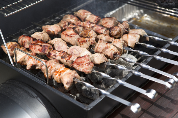 grilling shashlik on a barbeque grill