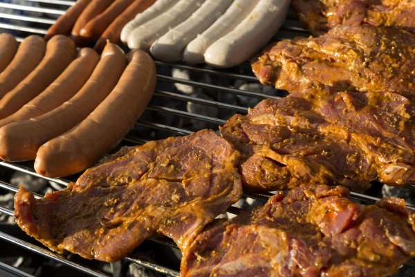meat and sausages on a barbecue
