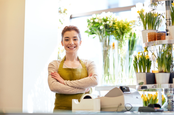 smiling florist woman at flower shop