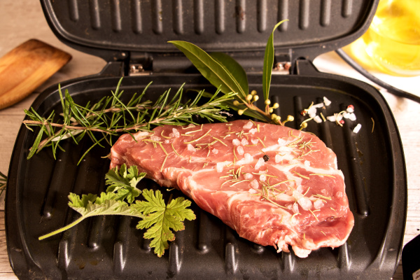 fleich with herbs on table grill