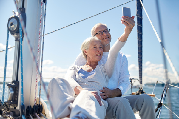 seniors with smartphone taking selfie on
