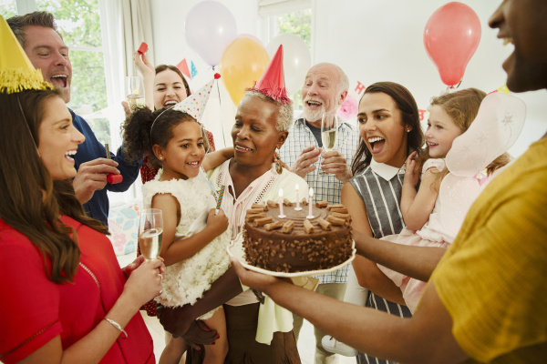 multi generation family celebrating birthday with