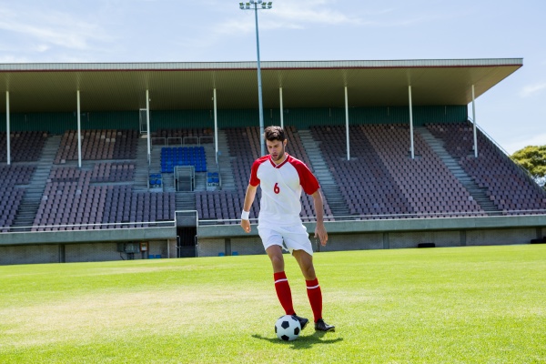 football player practicing soccer
