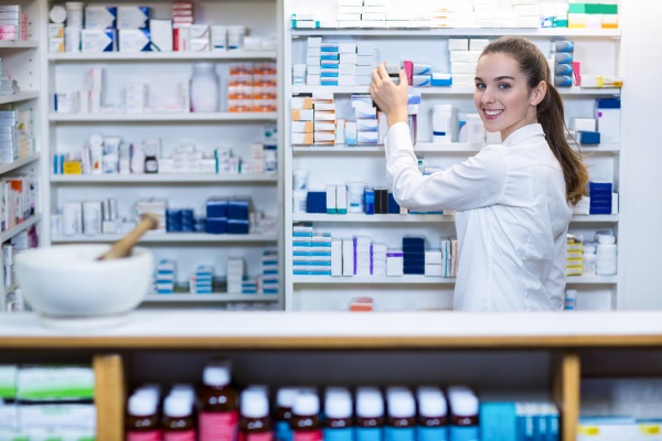 pharmacist checking a medicine in pharmacy