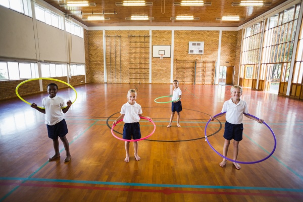 students playing with hula hoop in