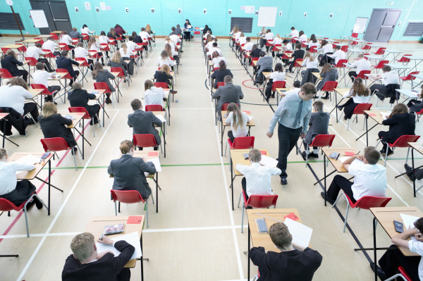 middle school students taking examination at