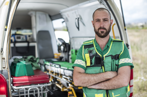 paramedic standing with arms crossed in
