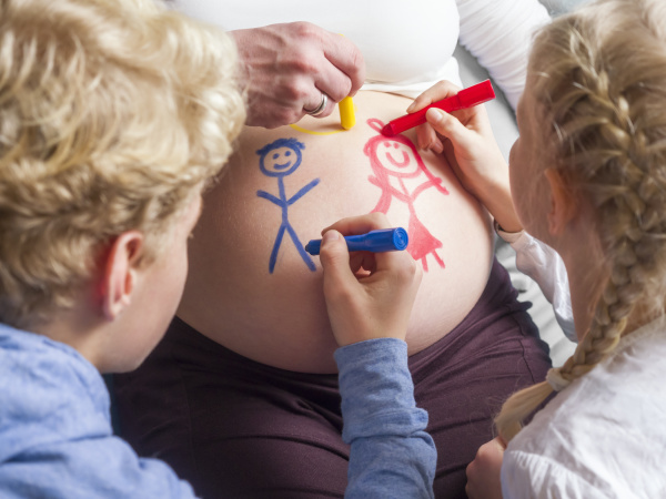 children painting on pregnant mother s