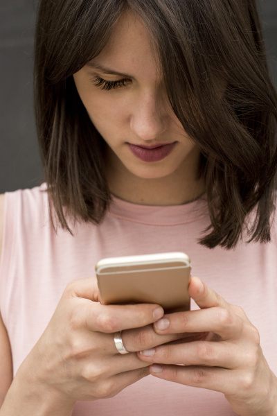 young woman text messaging