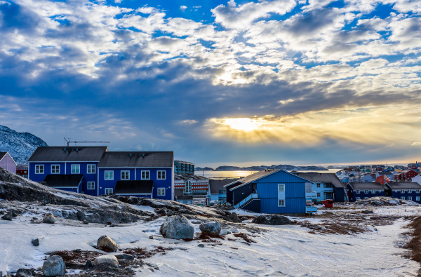 polar sunset over inuit houses on