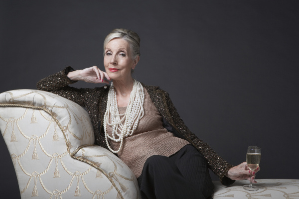 elegant senior woman on chaise lounge