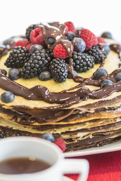 a pancake cake with berries and